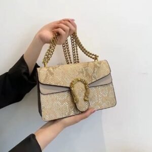 BOLSO COBRA 25 DORADO